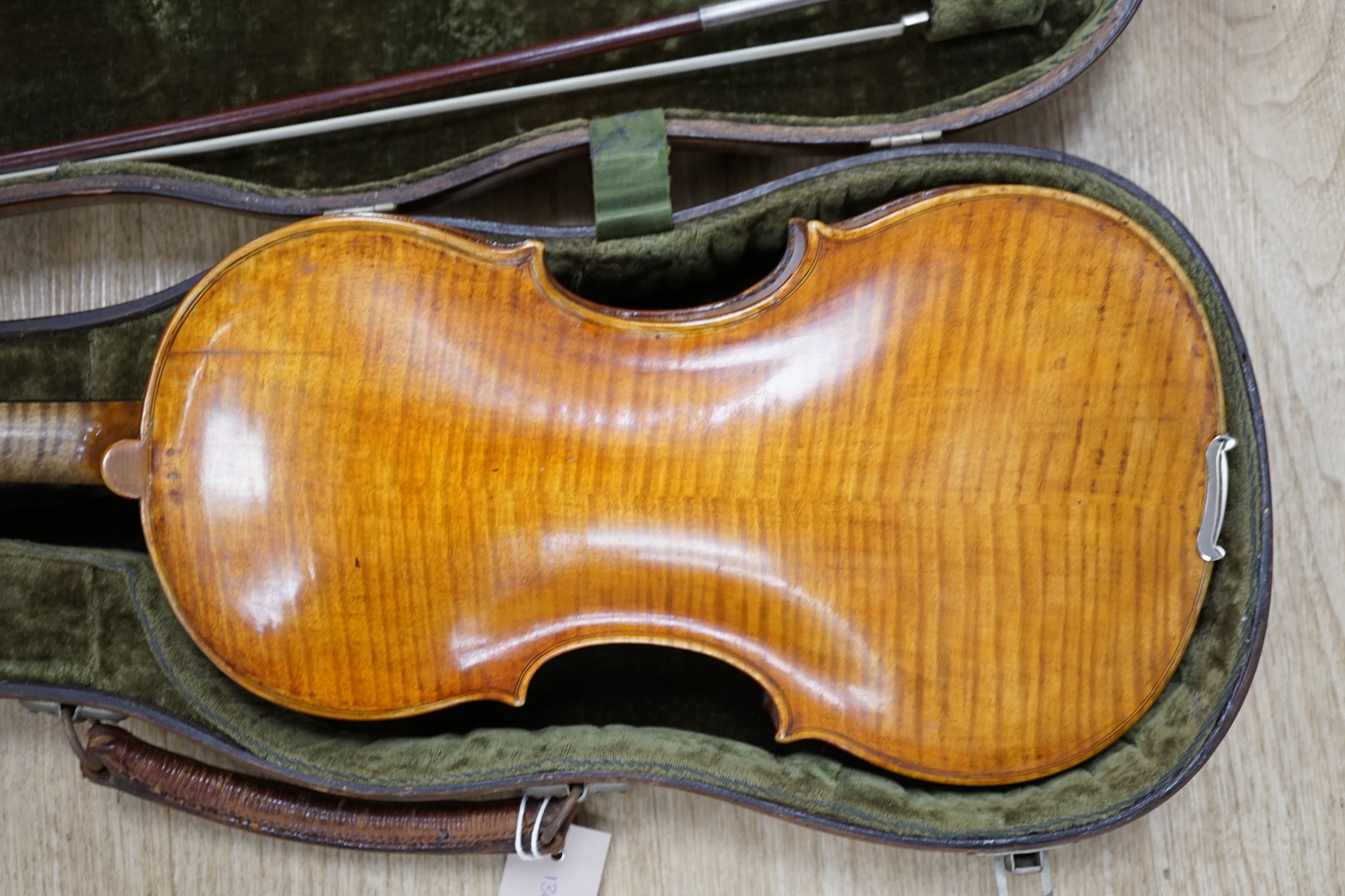 An early 19th century cased Italian violin labelled Florentus Florenus, body length 35cm, with a French silver mounted bow stamped Cuniot Hury, both in a fine Hill style case CITES Submission reference 6VGB2X83